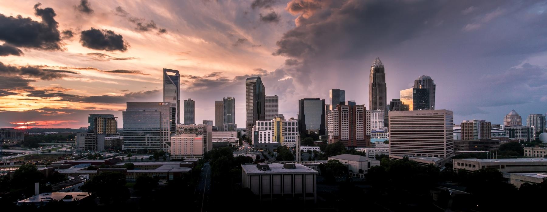 a city skyline at sunset